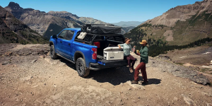 A person using their 2025 Chevrolet Silverado 1500 for a camping trip near Frederic, WI